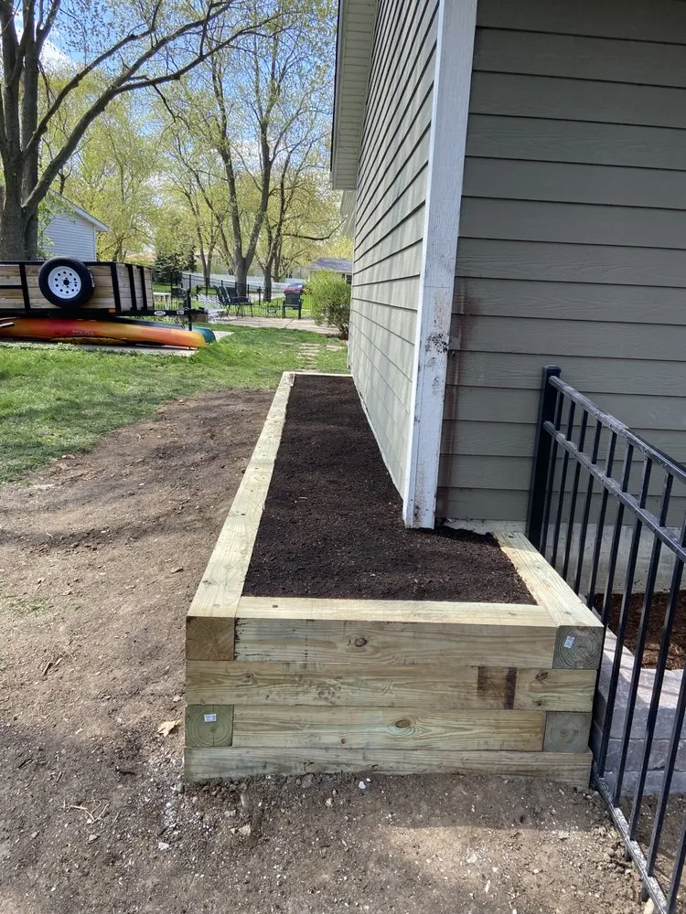 Custom lawn mowing service for residential properties in Warrenville, IL by Gracias Hardscape & Landscape