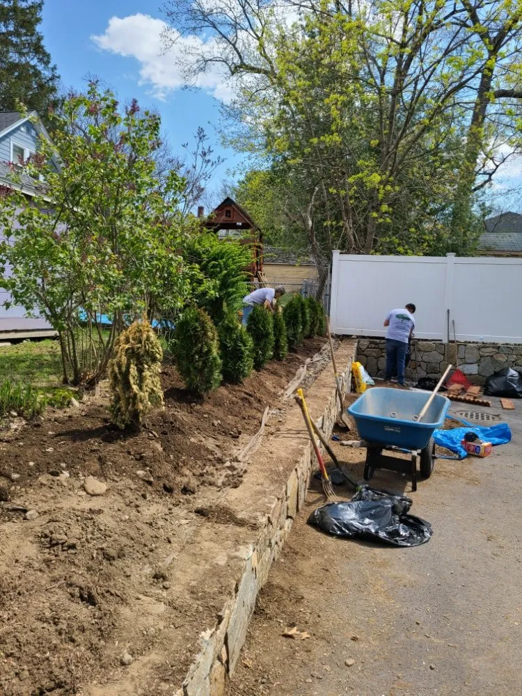 Custom landscape installation for outdoor upgrades in Waltham, MA by Gramajo Landscaping Service