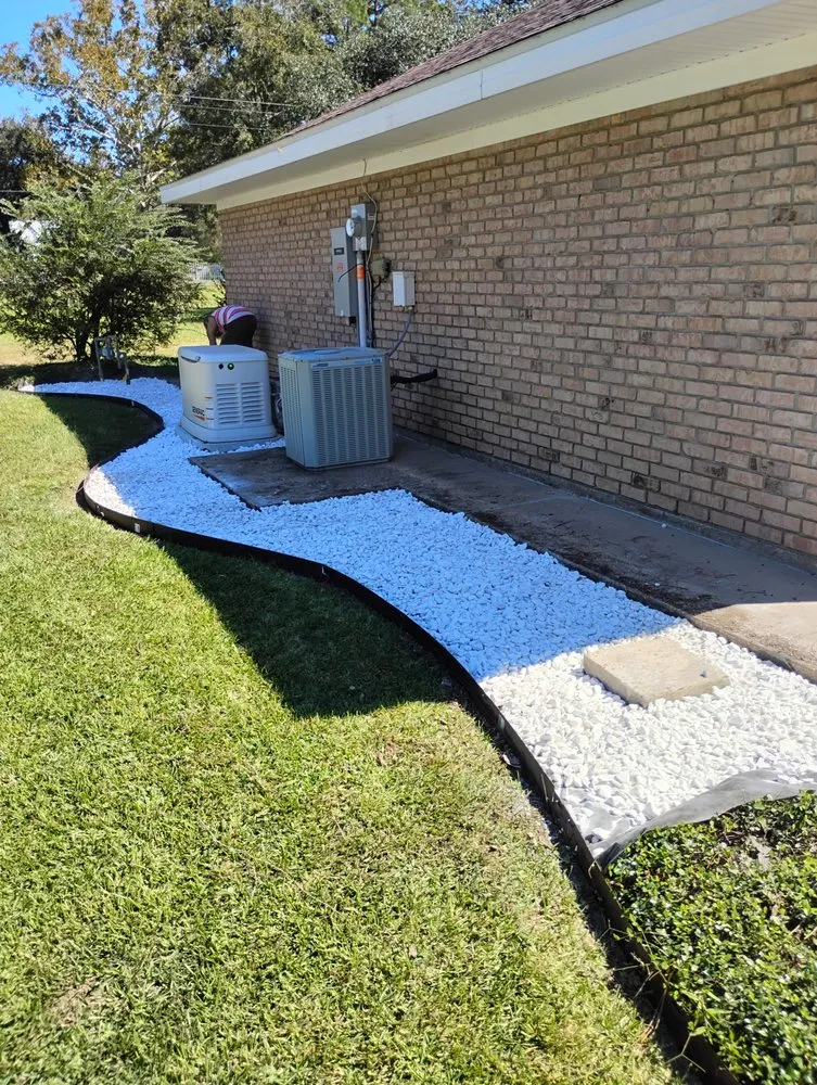 Custom landscape installation for outdoor upgrades in Saint Martinville, LA by Grass & Handy Maintenance