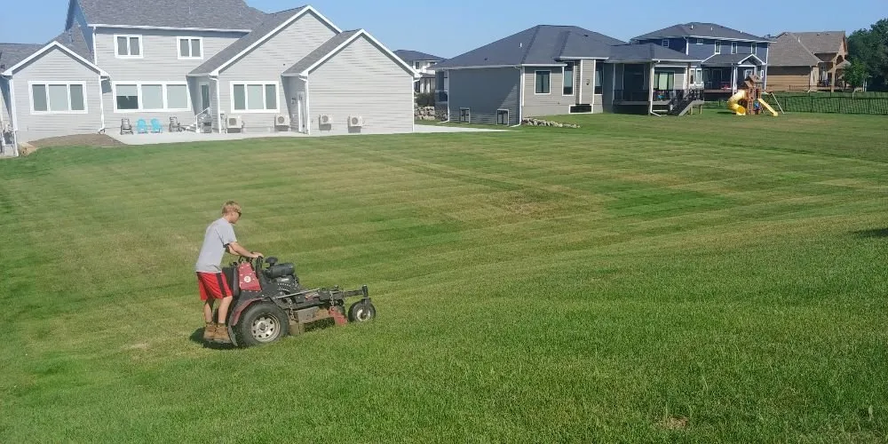 Custom landscape design for beautiful yards across Des Moines, IA - GRASS GRABBERS Lawn & Landscape