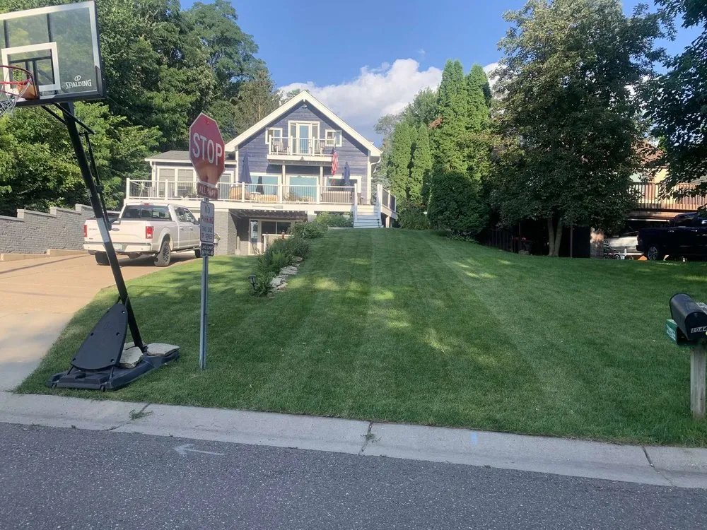 Professional yard maintenance for residential properties in Pine Springs, MN by Grass Guardians Landscaping
