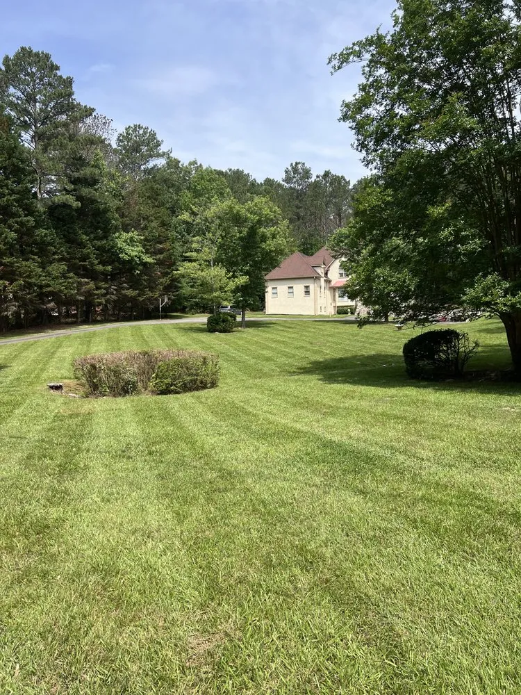 Professional yard maintenance for residential properties in Fayetteville, GA by Grass Kicking Landscaping