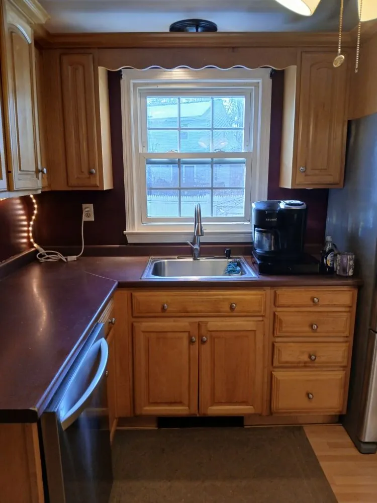 Professional yard cleanup service for residential properties in Dracut, MA by Grasshopper Lawn Care & Painting