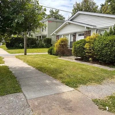 Grasshopper Mowing Logo