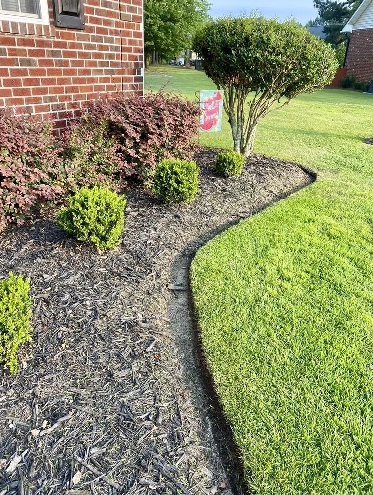 Custom outdoor landscaping in Fayetteville, NC by Grasshoppers Lawn Service