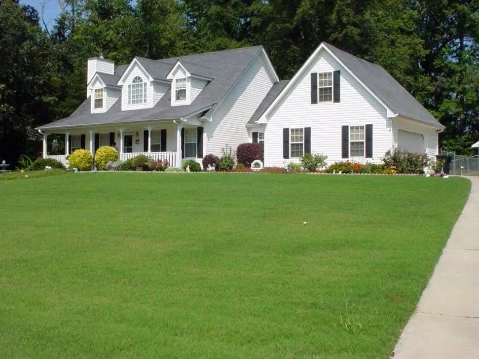 Professional lawn mowing service with custom design across Newberry, FL - GrassHoppers Total Lawn Care