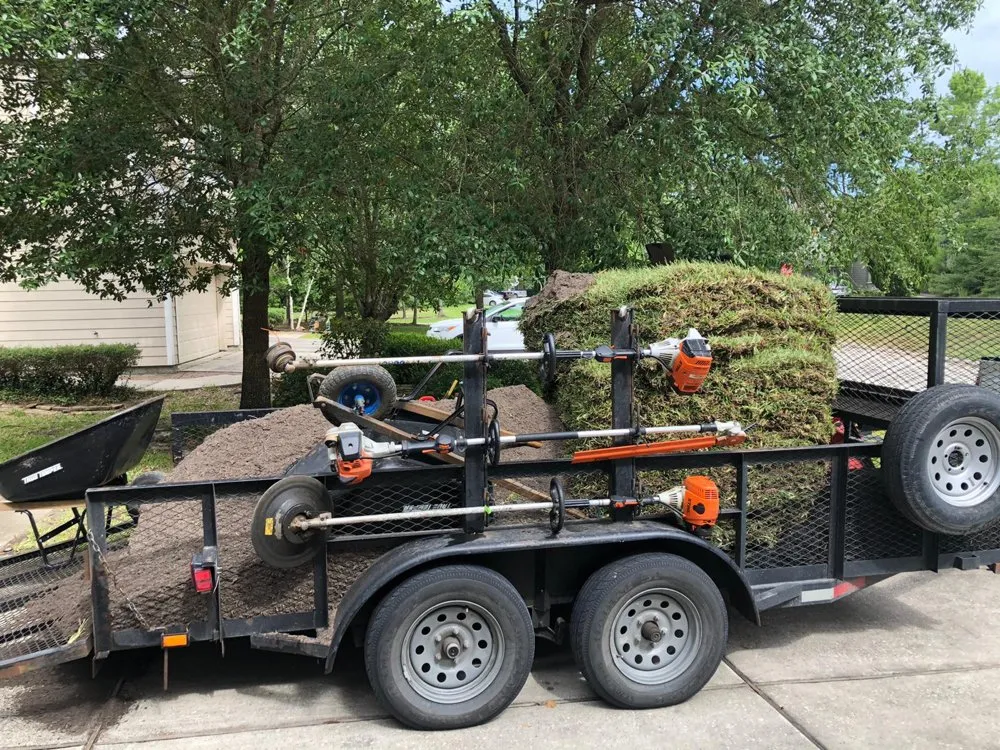 Professional lawn mowing service for outdoor upgrades in Tomball, TX by Grasshoppers Tree Cut