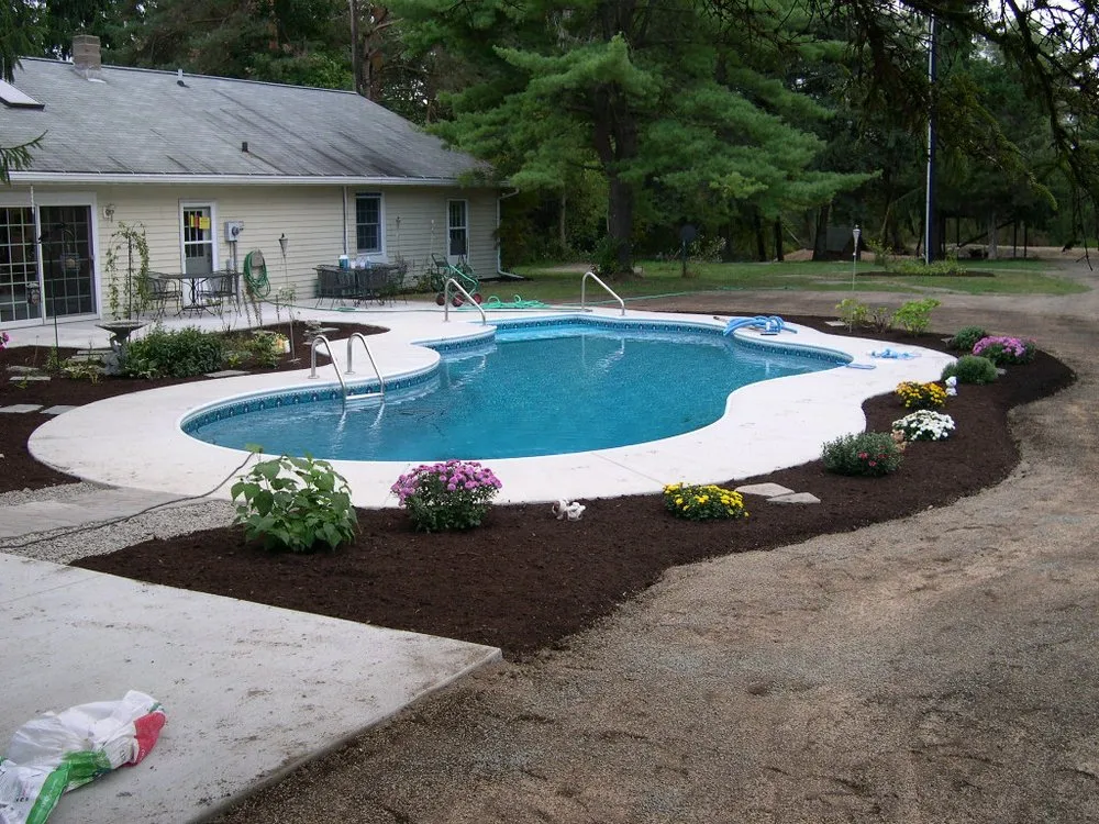 Top-rated lawn care service with custom design in Freeville, NY by Grassmasters Landscaping
