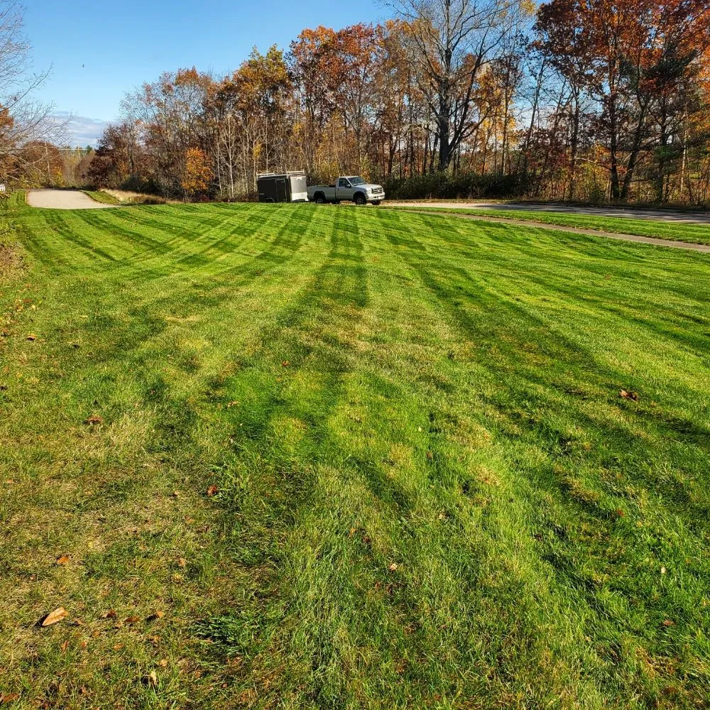 Professional lawn mowing service for residential properties in Sanford, ME by Grassroots Landscaping