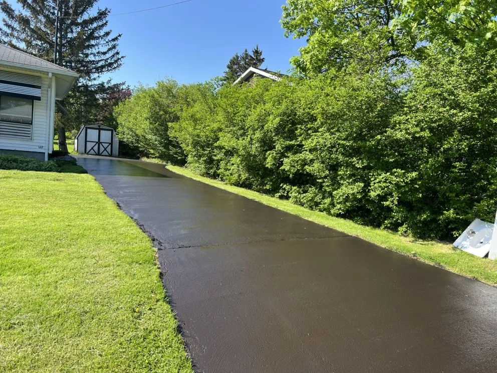 Custom landscape design for homes in Newark, NY by GRC Lawn Care Service