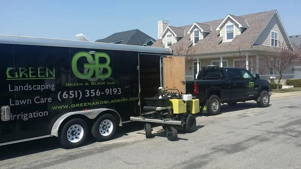 Expert lawn mowing service experts serving Apple Valley, MN - Green & Black