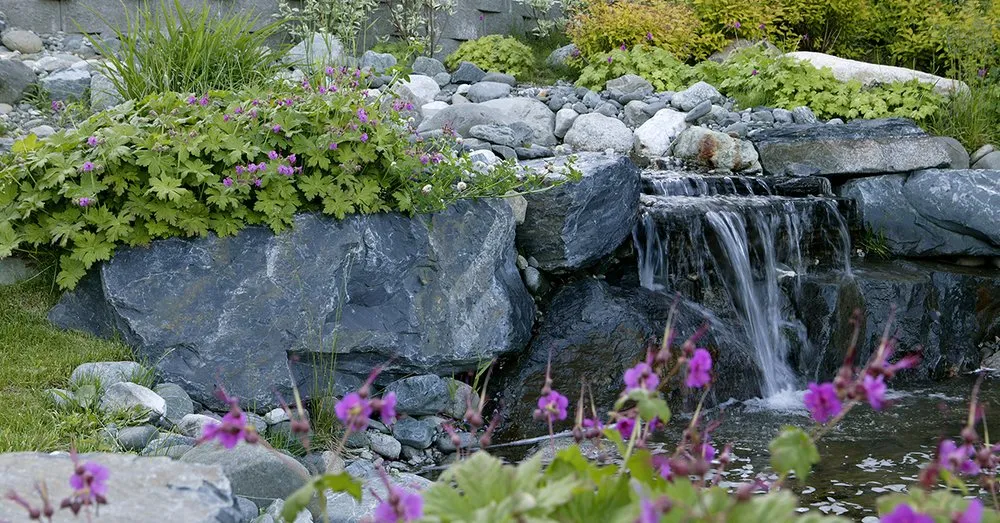 Professional landscape installation with custom design in Anchorage, AK by Green Acres