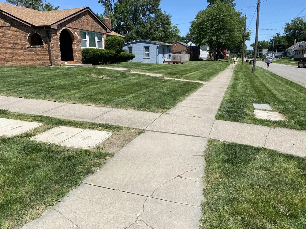 Top-rated lawn mowing service with custom design in Carlisle, IA by Green Acres Landscaping