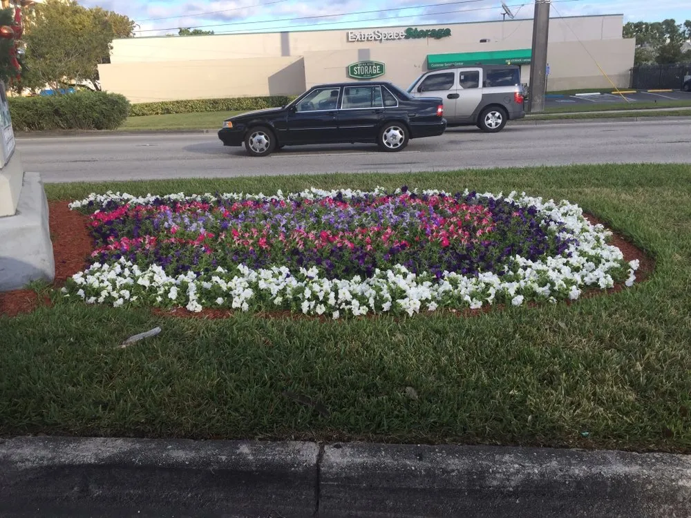 Custom garden landscaping in Hallandale Beach, FL by Green Care Lawn and Tree Service