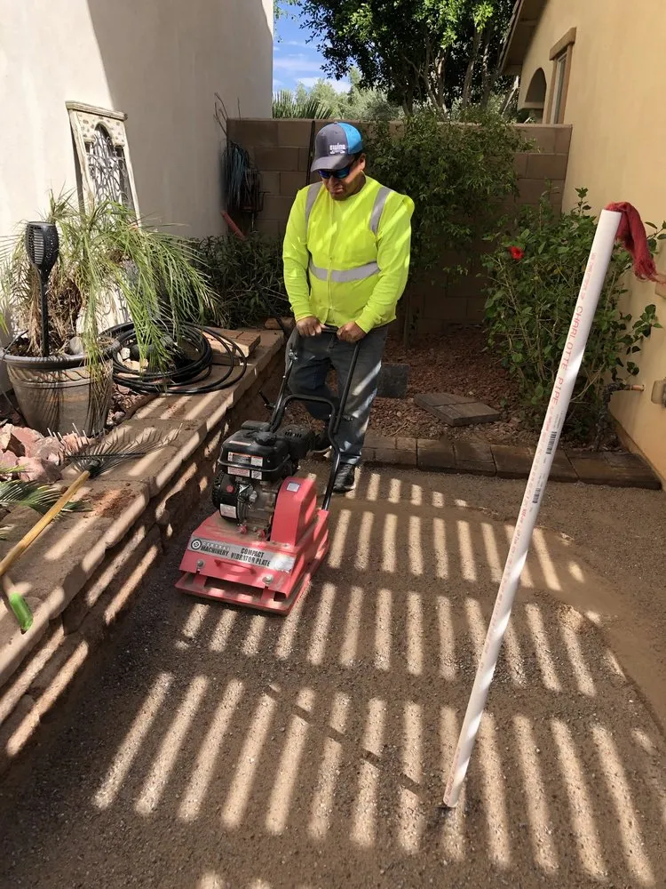 Affordable lawn mowing service for year-round maintenance in Wenden, AZ by Green district management
