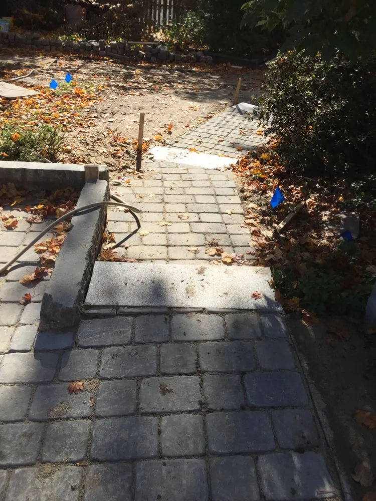 Custom lawn mowing service for year-round maintenance across Dartmouth, MA - Green Earth Landscaping