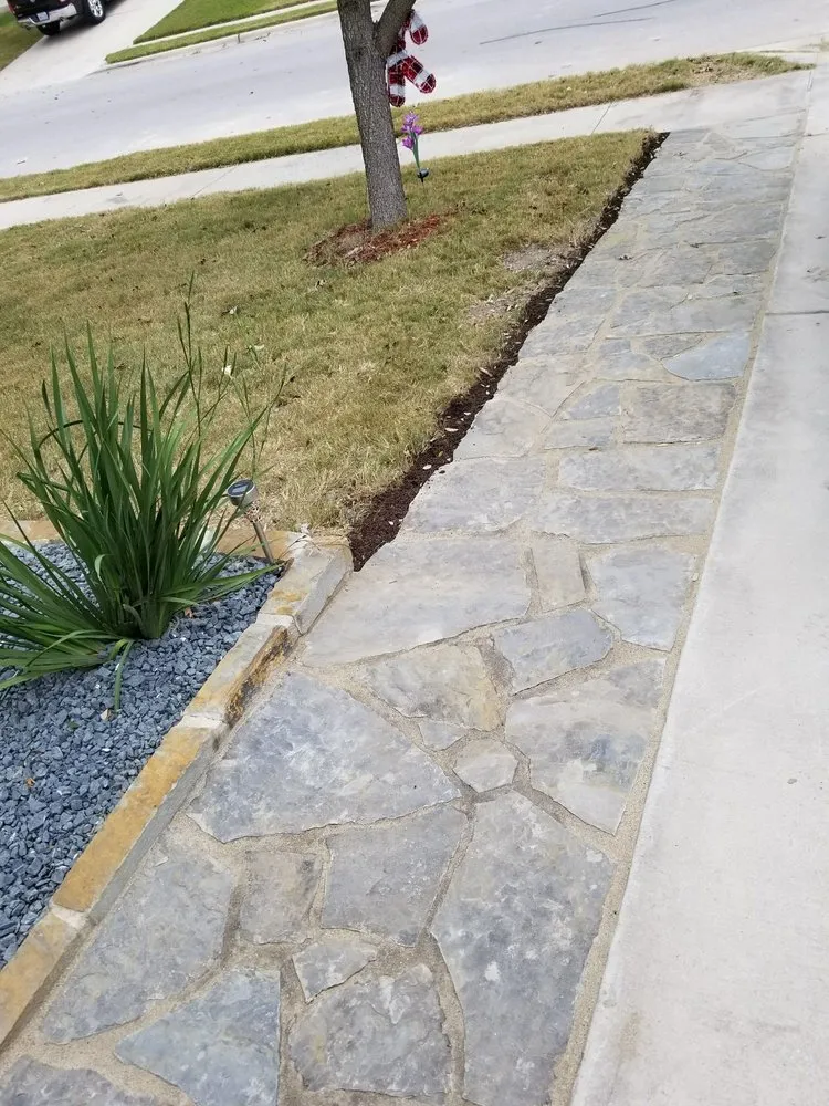 Professional lawn care service for year-round maintenance in Austin, TX by Green Ease Landscapes & Design