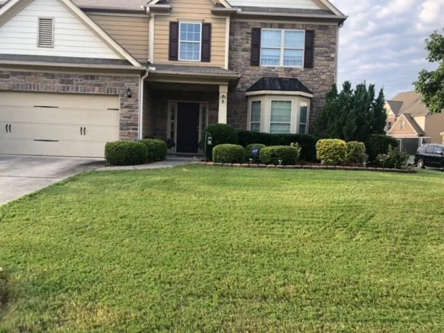 Custom garden landscaping with custom design in Fayetteville, GA by Green Edge Lawn Care