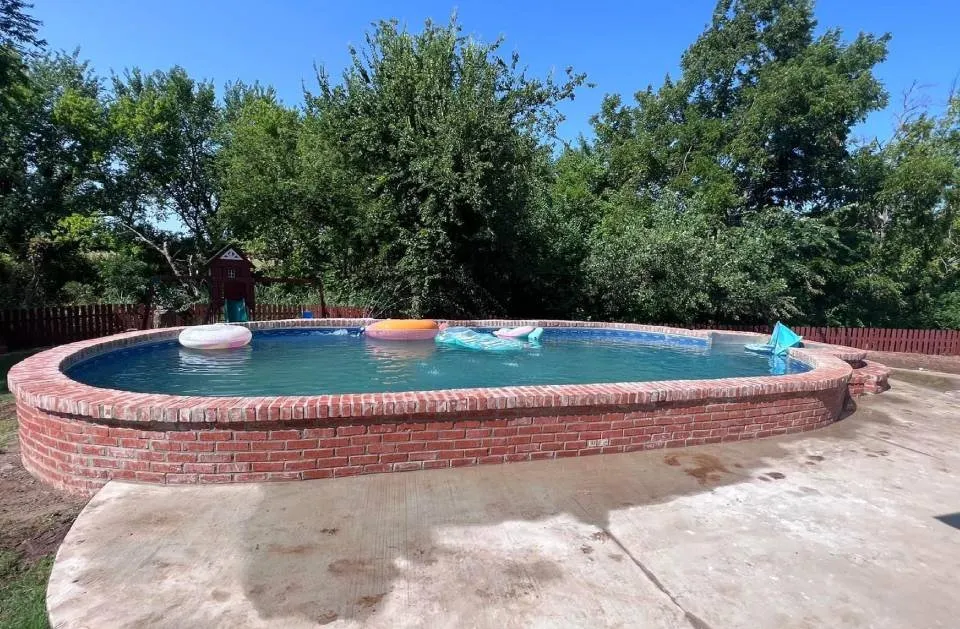 Custom lawn mowing service for year-round maintenance in Tuttle, OK by Green Escape Oasis & Const