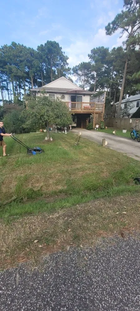 Professional lawn mowing service for residential properties across Kill Devil Hills, NC - Green Guru