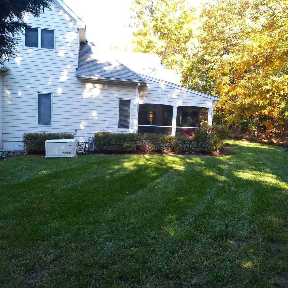 Custom lawn mowing service for homes in Richmond, VA by Green Harvest Landscaping