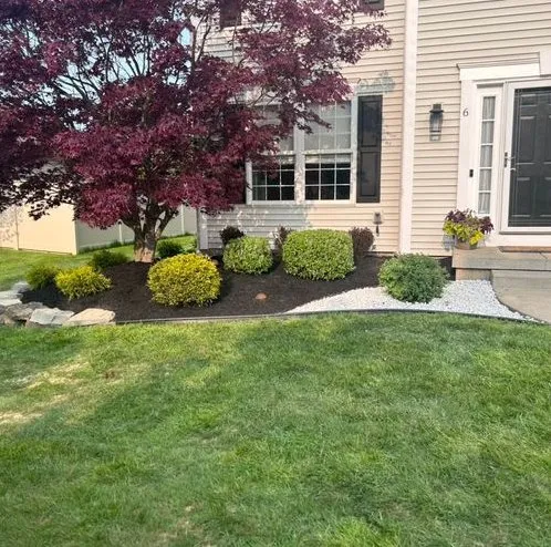 Professional lawn care service for homes in Islip, NY by Green Horizon Landscaping & Design