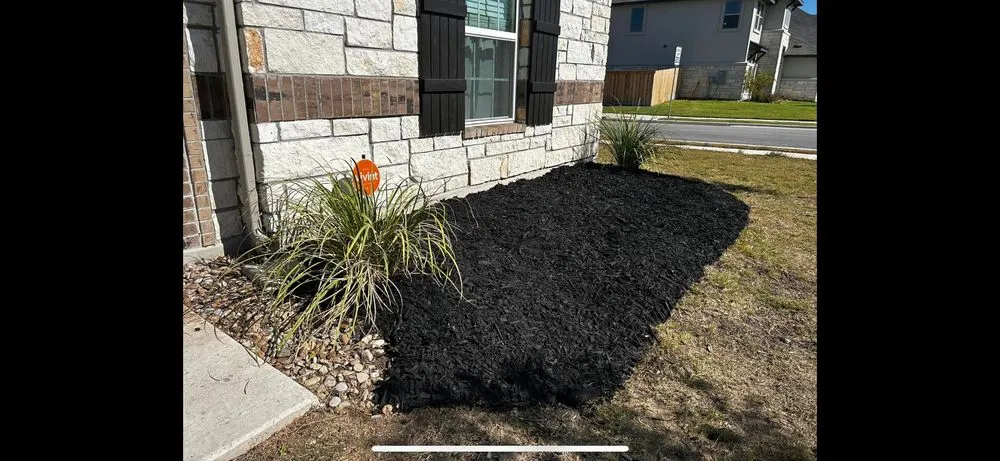 Custom landscape installation in Mustang Ridge, TX by Green Lawn Landscape & Maintenance