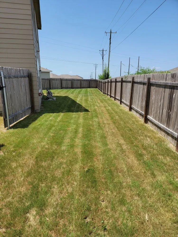 Expert lawn mowing service for residential properties in Georgetown, TX by Green Machines Lawn Care