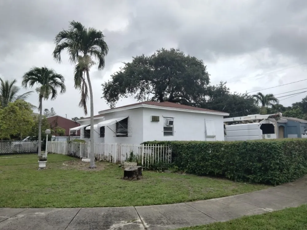 Professional lawn care service for homes in Miami, FL by Green Motion Groundskeepers