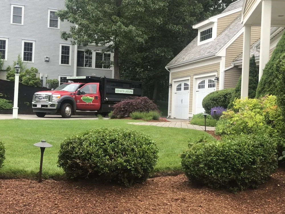 Top-rated lawn mowing service with custom design in Pembroke, MA by Green Nation Landscaping and Tree Service