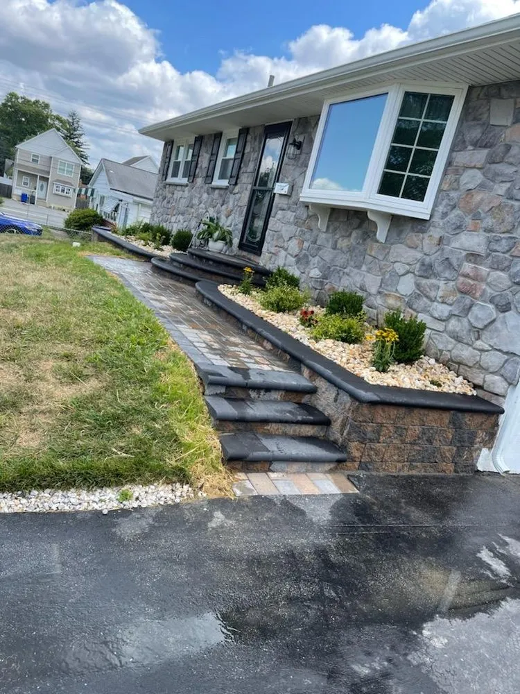 Professional lawn mowing service for residential properties in Newark, DE by Green Planet 's Erni Landscaping / Hardscaping