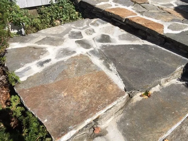 Custom yard cleanup service for year-round maintenance in West Springfield, MA by Green Stone Landscaping