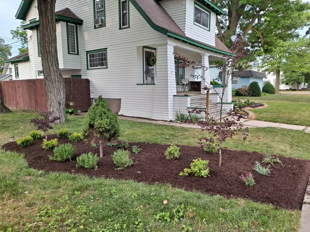 Custom residential landscaping with custom design in Cass City, MI by Green Thumb Lawn And Landscape