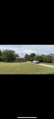 Green Thumbs Up Lawn Maintenance Logo