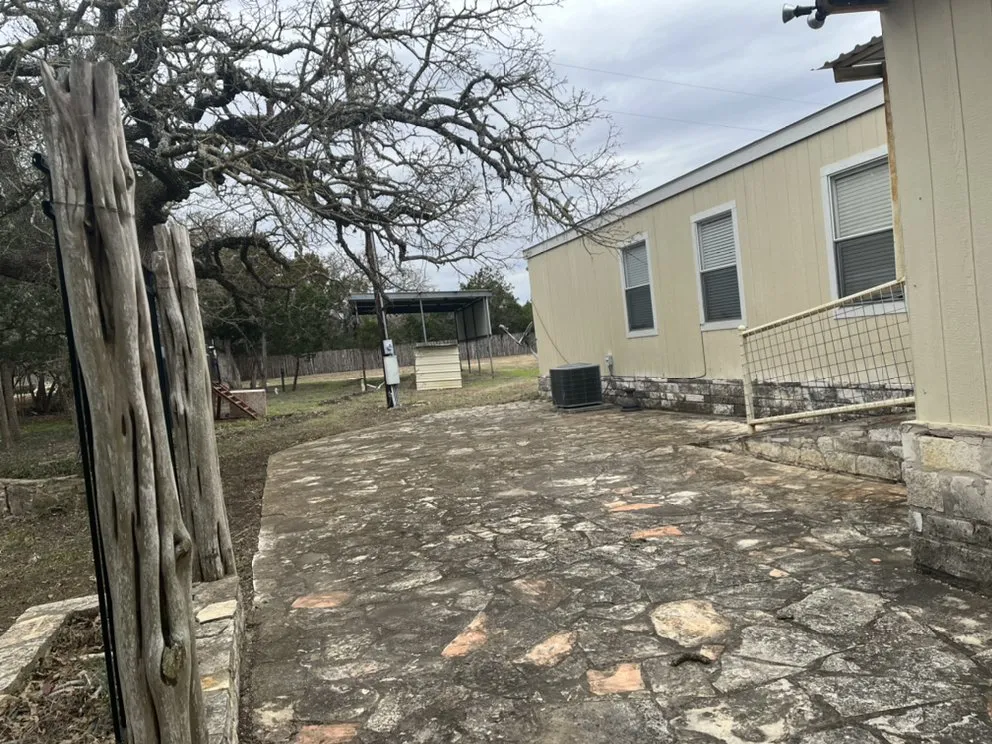 Custom yard cleanup service for year-round maintenance in Kyle, TX by Green Turf Landscaping