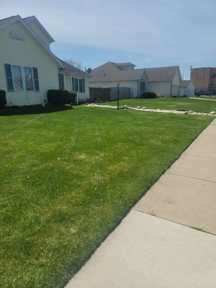 Reliable lawn mowing service in South Bend, IN by Green With Envy