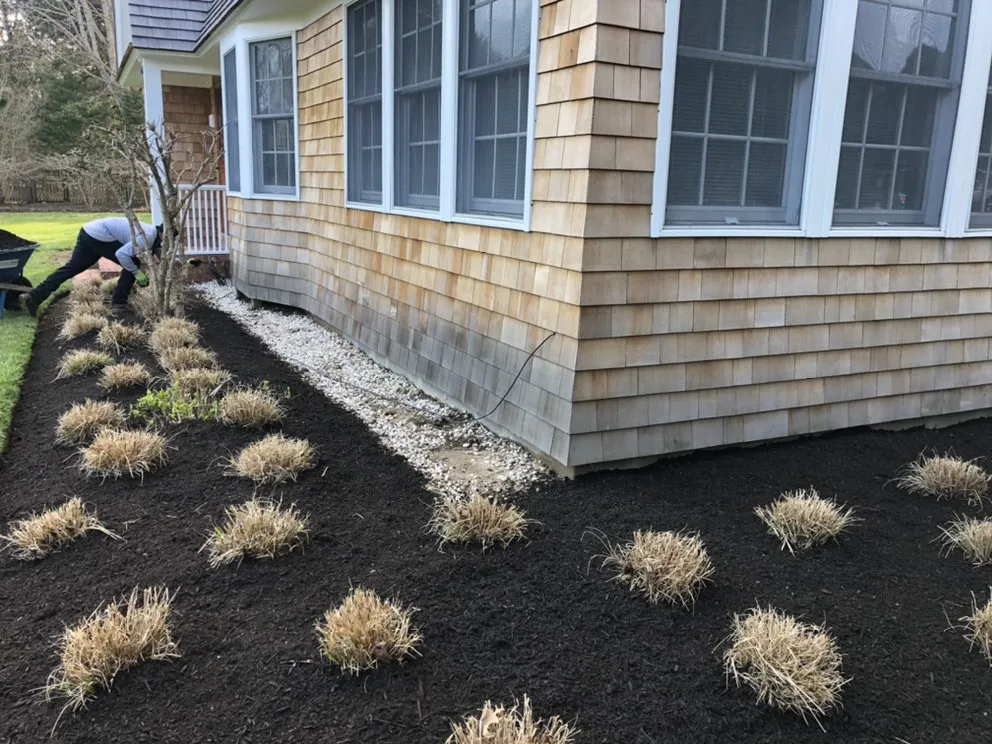 Custom lawn mowing service for outdoor upgrades in East Hampton, NY by Greenfield Landscapers