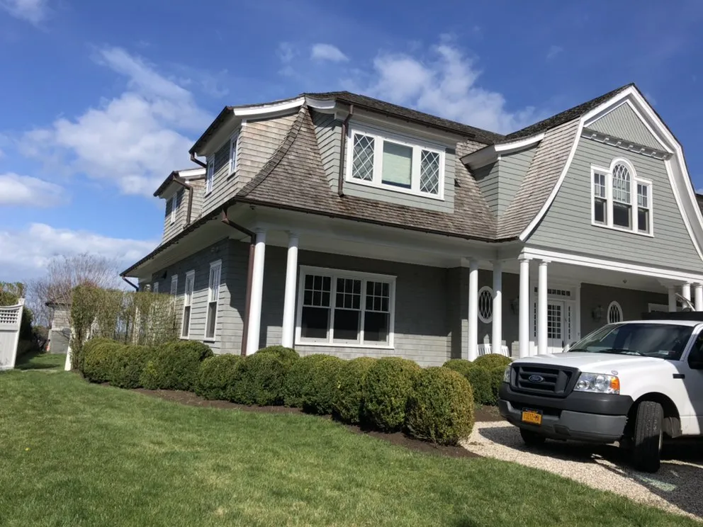 Expert landscaping services for residential properties in East Hampton, NY by Greenfield Landscapers