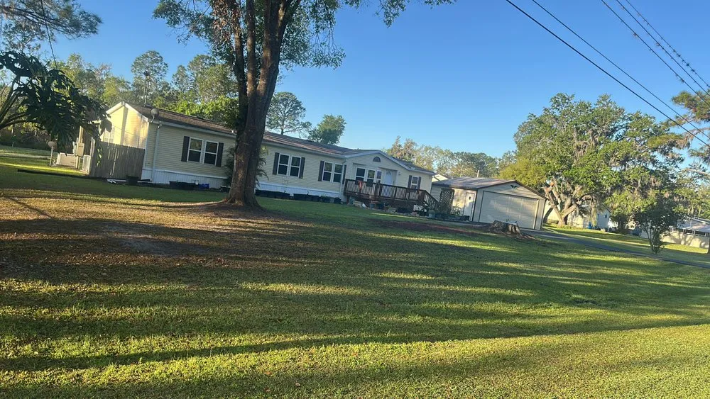 Expert lawn mowing service with custom design in Lakeland, FL by Greenland Landscaping and Cleaning Services