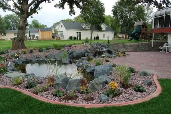 Custom landscape installation for residential properties in Mapleton, ND by Greenscape Companies