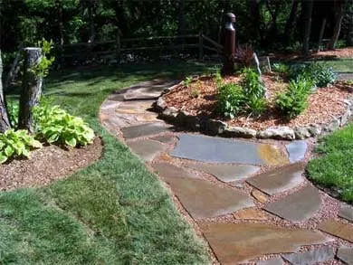 Custom outdoor landscaping in Topeka, KS by Greentouch Lawn & Tree