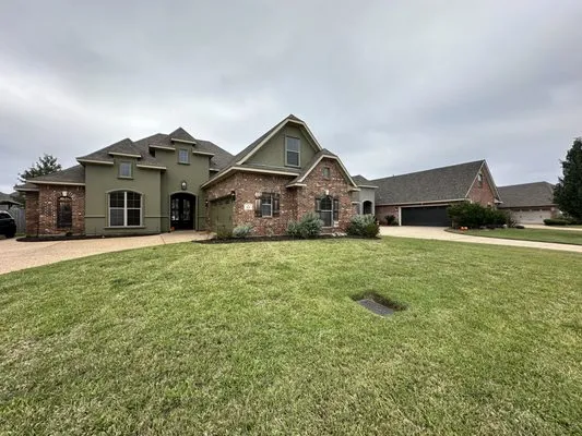 Greer’s Green Thumb Lawn Care Logo