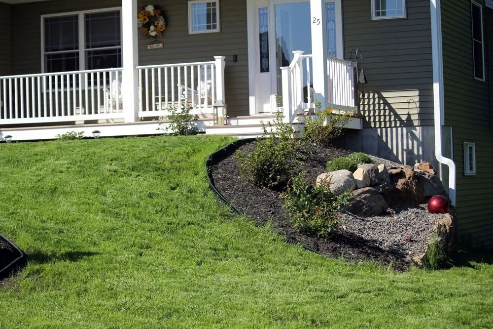 Custom landscape installation in Barrington, NH by Griffith Landscapes