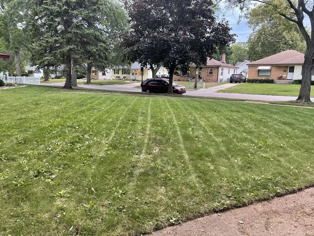 Custom lawn mowing service for outdoor upgrades in Grand Rapids, MI by GrindStone Lawn and snow