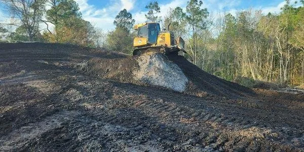 Professional yard cleanup service for residential properties in Bunnell, FL by Grindstone Tree Service and Land Worx