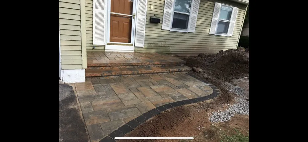 Custom landscape design in Liverpool, NY by Ground Force Property Services