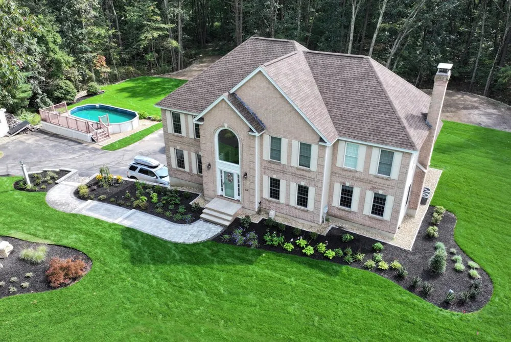 Professional outdoor landscaping in New Hampton, NH by Groundhog North