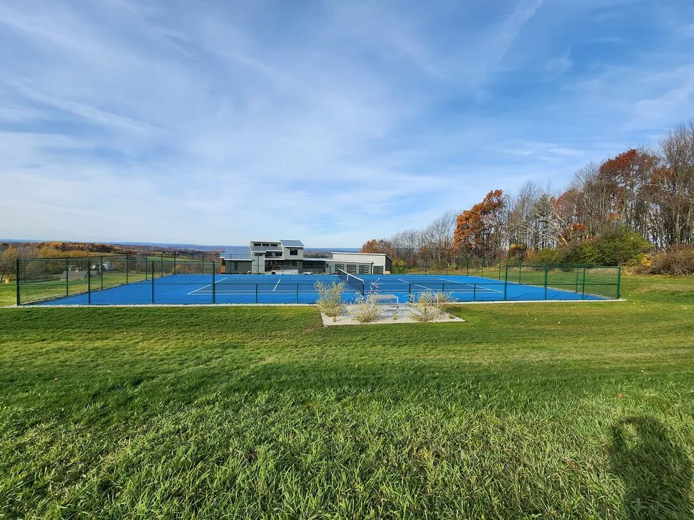 Professional outdoor landscaping for residential properties in Queensbury, NY by Groundhogs Lawn Care