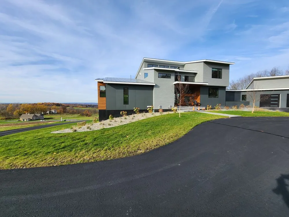 Custom outdoor landscaping for year-round maintenance in Queensbury, NY by Groundhogs Lawn Care