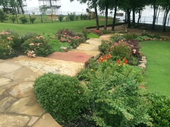 Custom yard cleanup service for year-round maintenance in Haltom City, TX by GroundScape Solutions